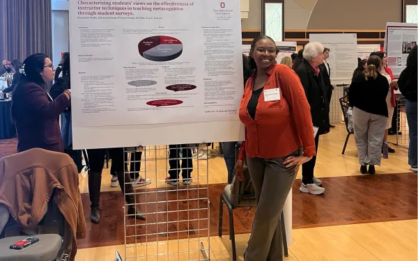 Brooklyn Watts with research poster at Denman Undergrad Research Forum